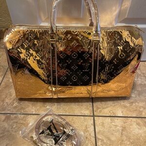 🔥🔥🔥 Designer monogram copper mirror color Duffel Bag.